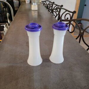 Tupperware hourglass salt and pepper shakers.